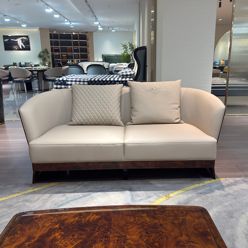 Ivory Curved Shell Sofa Collection in a furnished interior