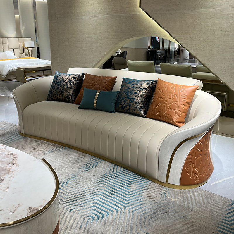 Ivory Sculpted Curve Sofa Collection in a furnished interior