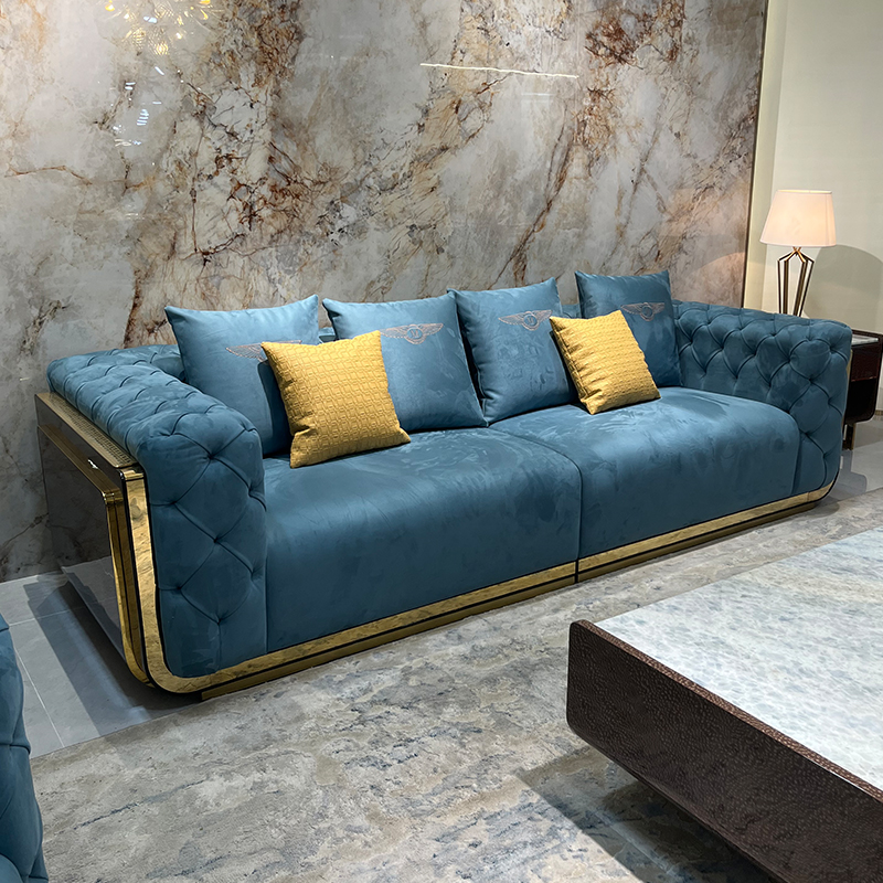 Blue Tufted Gold Accent Sofa Collection in a furnished interior