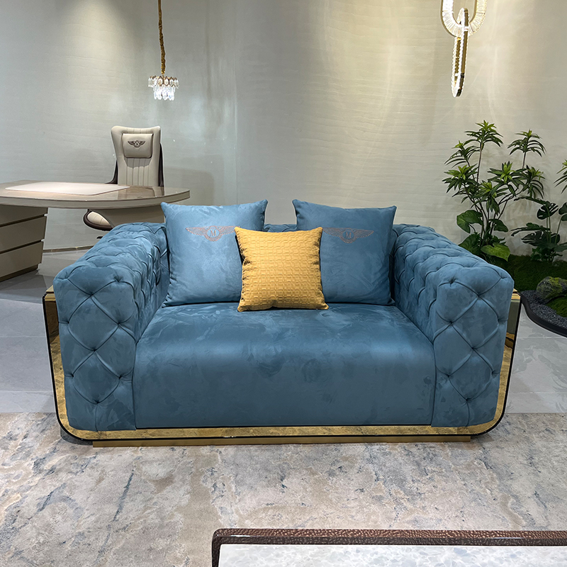 Blue Tufted Gold Accent Sofa Collection in a furnished interior