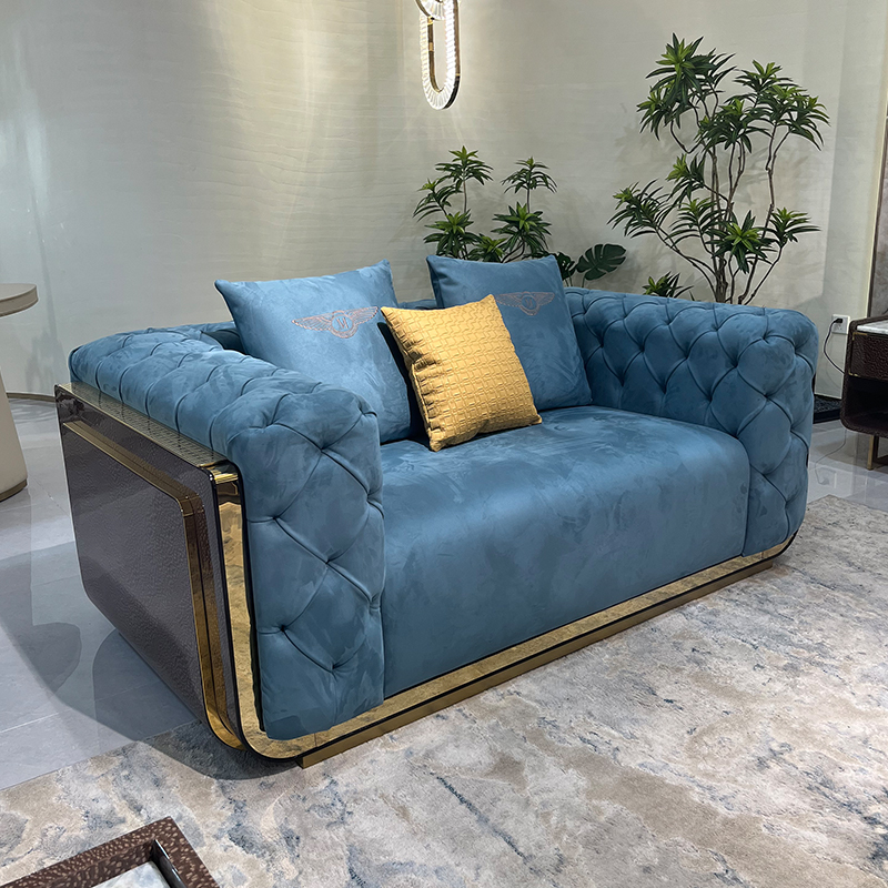 Blue Tufted Gold Accent Sofa Collection in a furnished interior